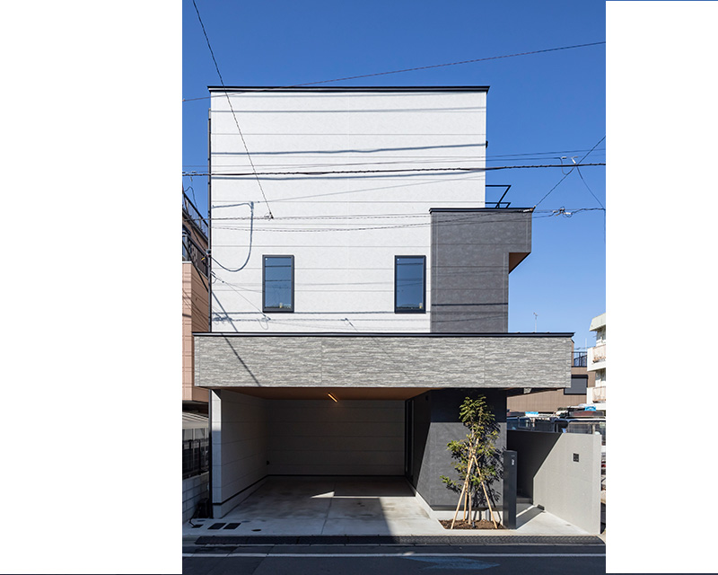 世帯をつなぐ《間》のある家